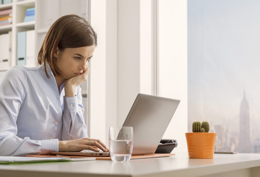 Business executive working with a laptop and connecting online